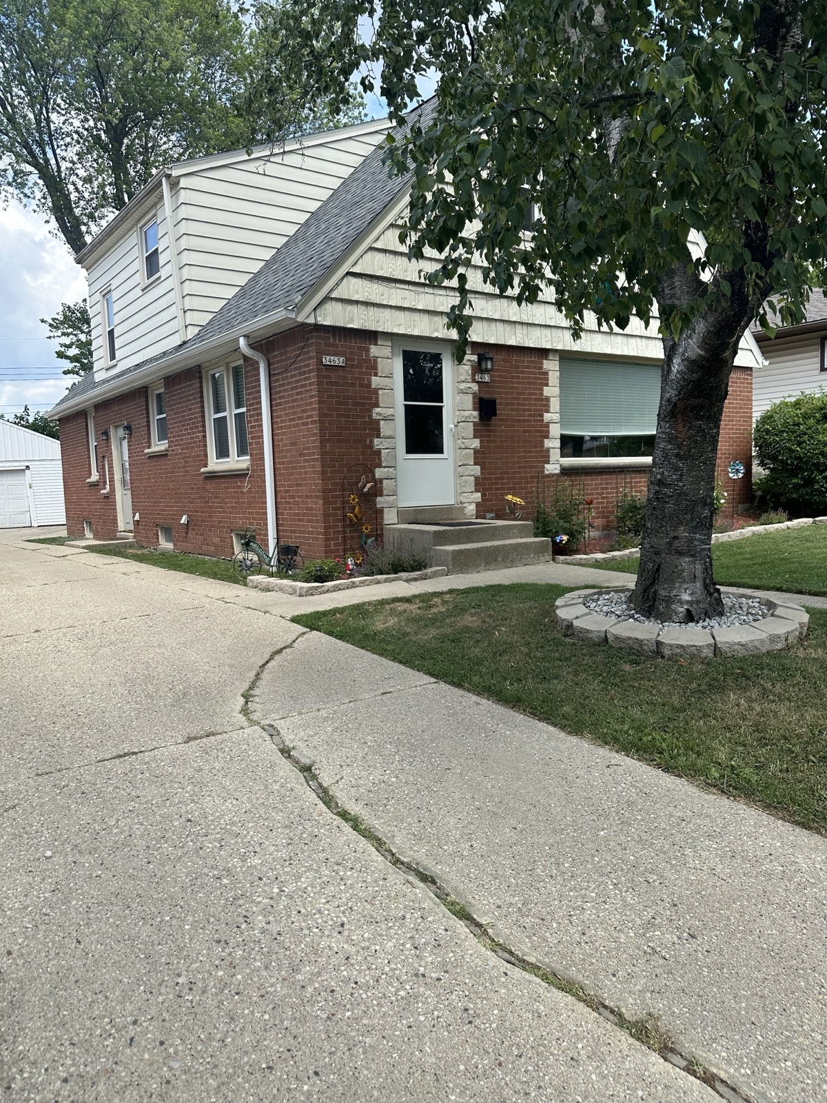 Murphy duplex property at 3463 N 98th Street, Milwaukee — side profile exterior view